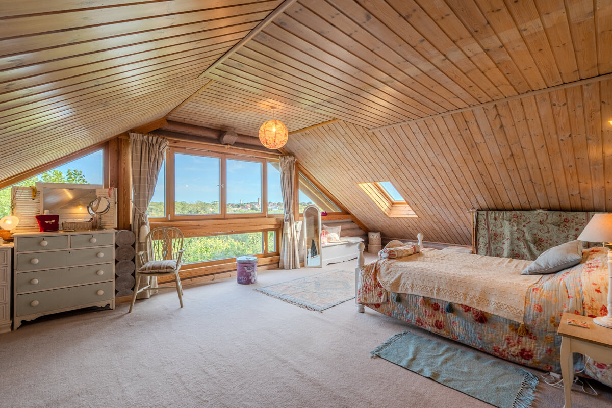 bedroom in log house with views towards Southwold