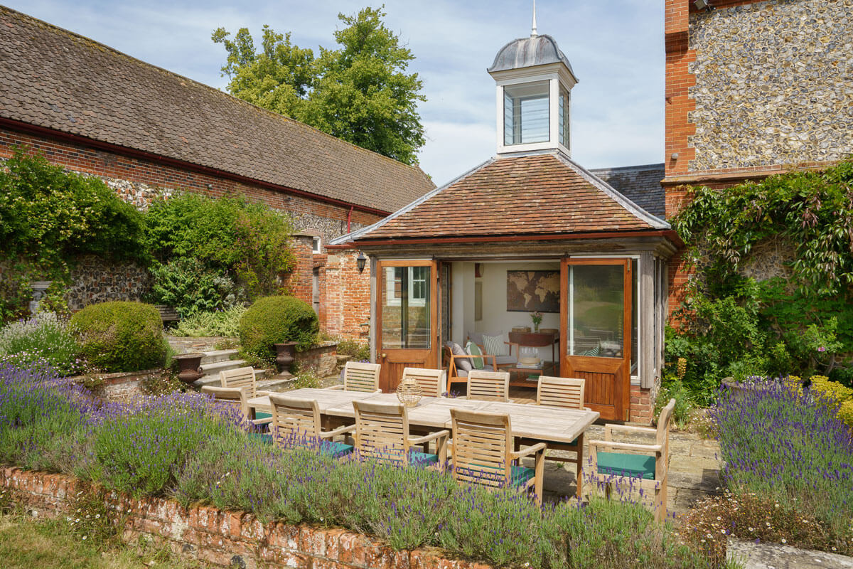 country-house-north-norfolk-garden exterior photography showing a patio table and garden room
