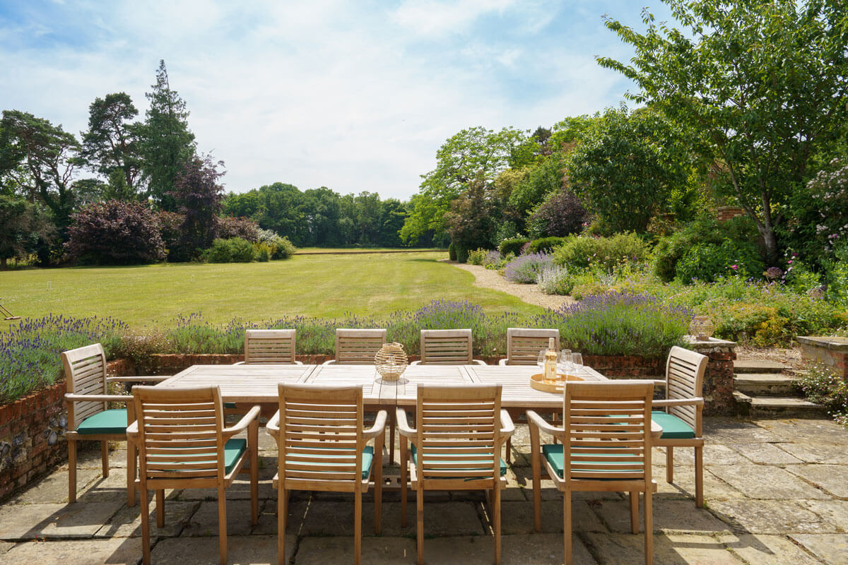 country_house_patio A large table in the country garden in manor house in Norfolk