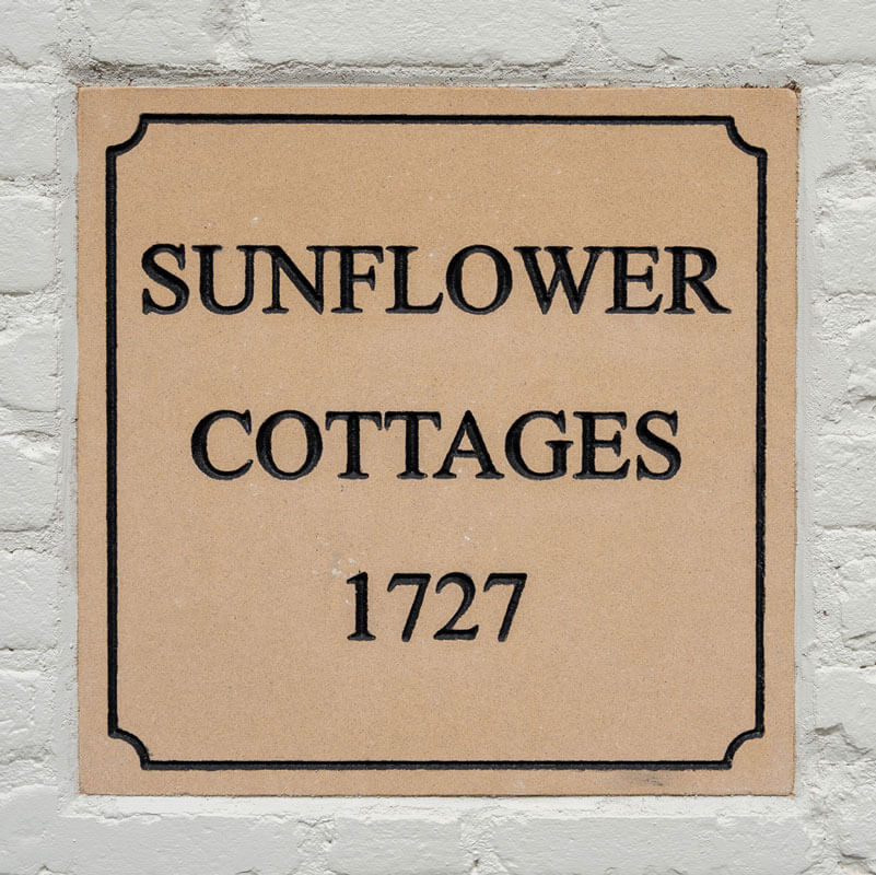 plaque reads sunflower cottages 1727